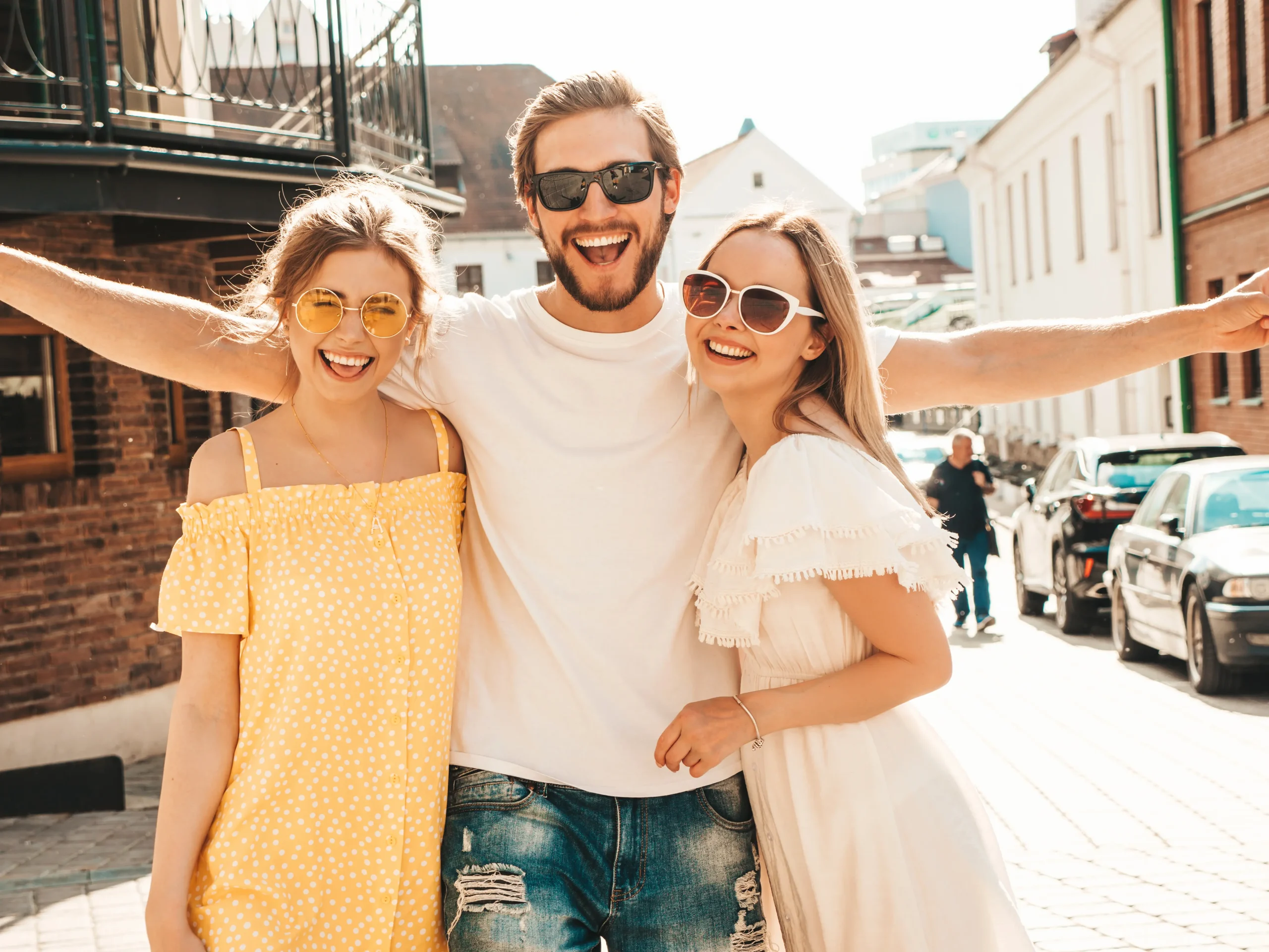 group-young-three-stylish-friends-posing-street-fashion-man-two-cute-girls-dressed-casual-summer-clothes-smiling-models-having-fun-sunglasses-cheerful-women-guy-going-crazy